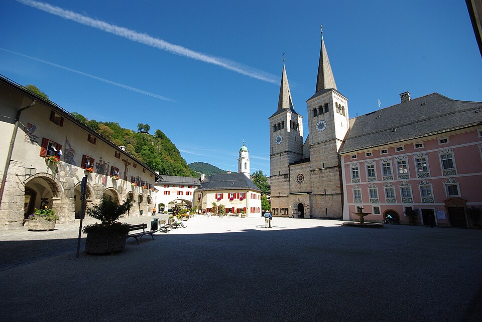 The arcaded Schlossplatz square in Berchtesgaden town with the two towers of the collegiate church.