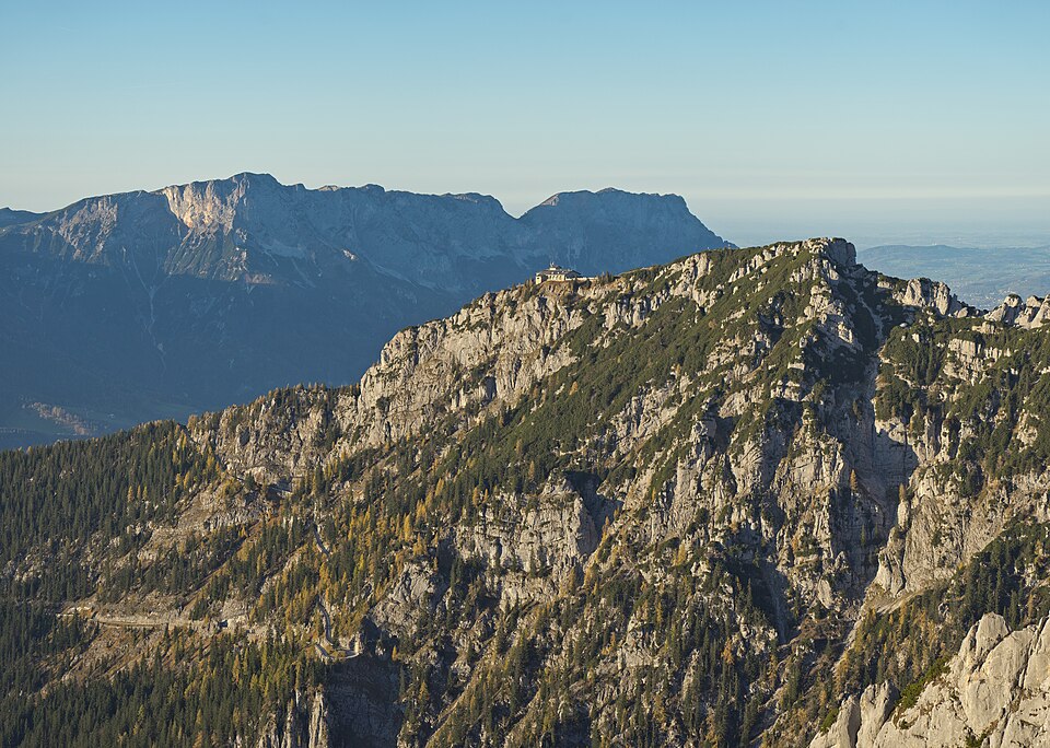 The rocky Kehlstein ridge with the small Kehlsteinhaus building on its summit and the Untersberg massif in the distance.